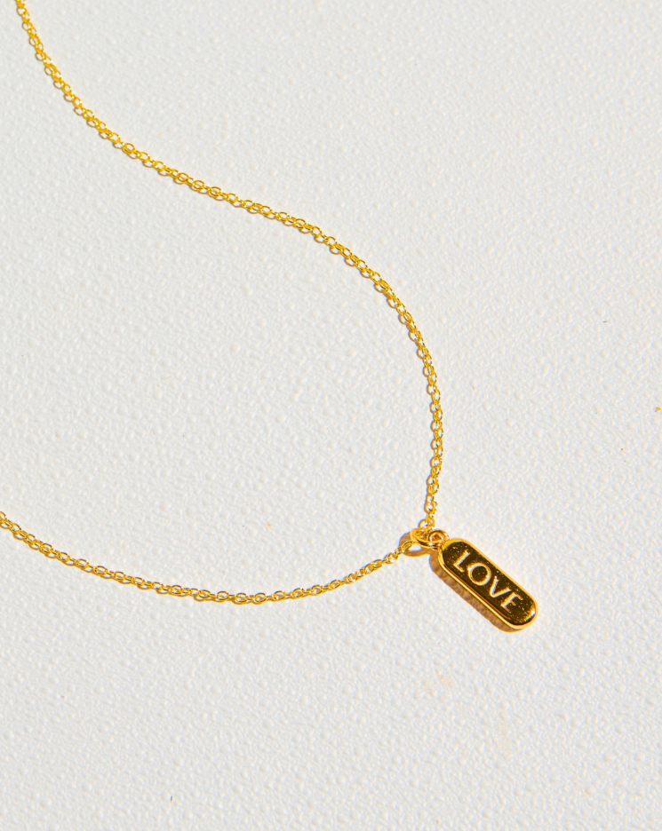 ENGRAVED LOVE PILL NECKLACE